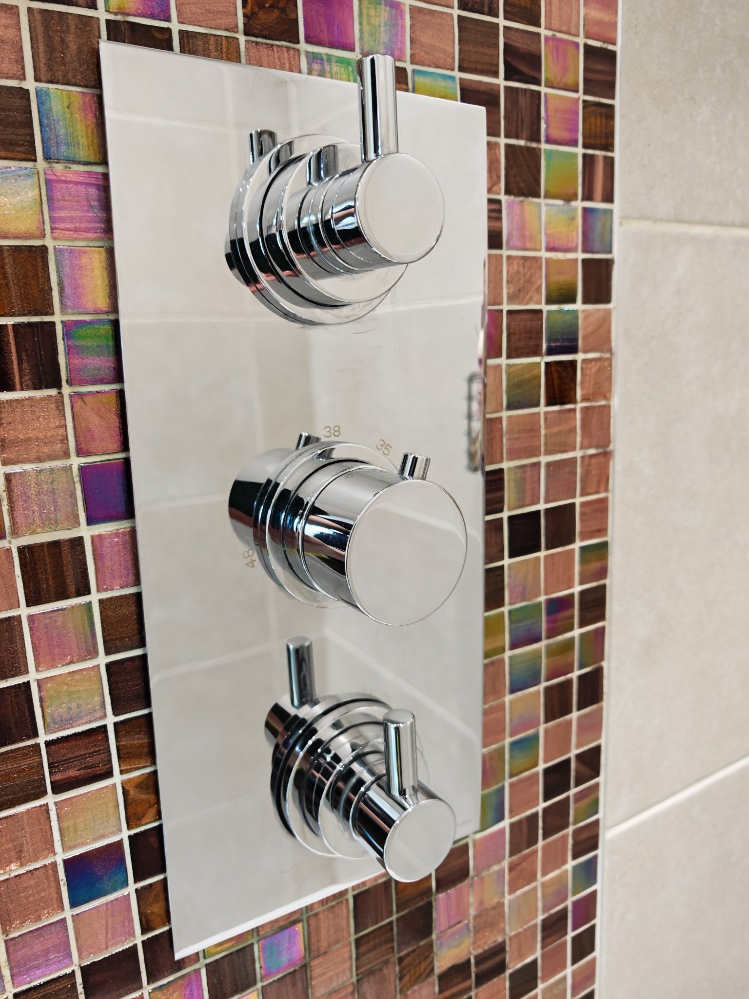 Polished chrome shower controls